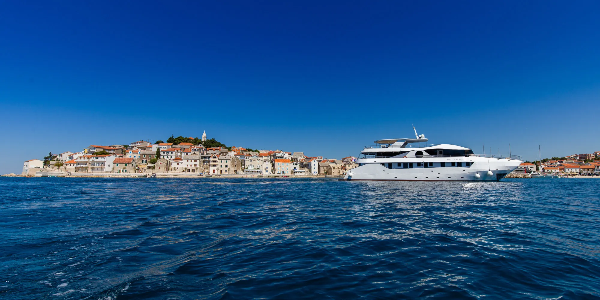 Small luxury cruise ship at anchor — Croatia 2027