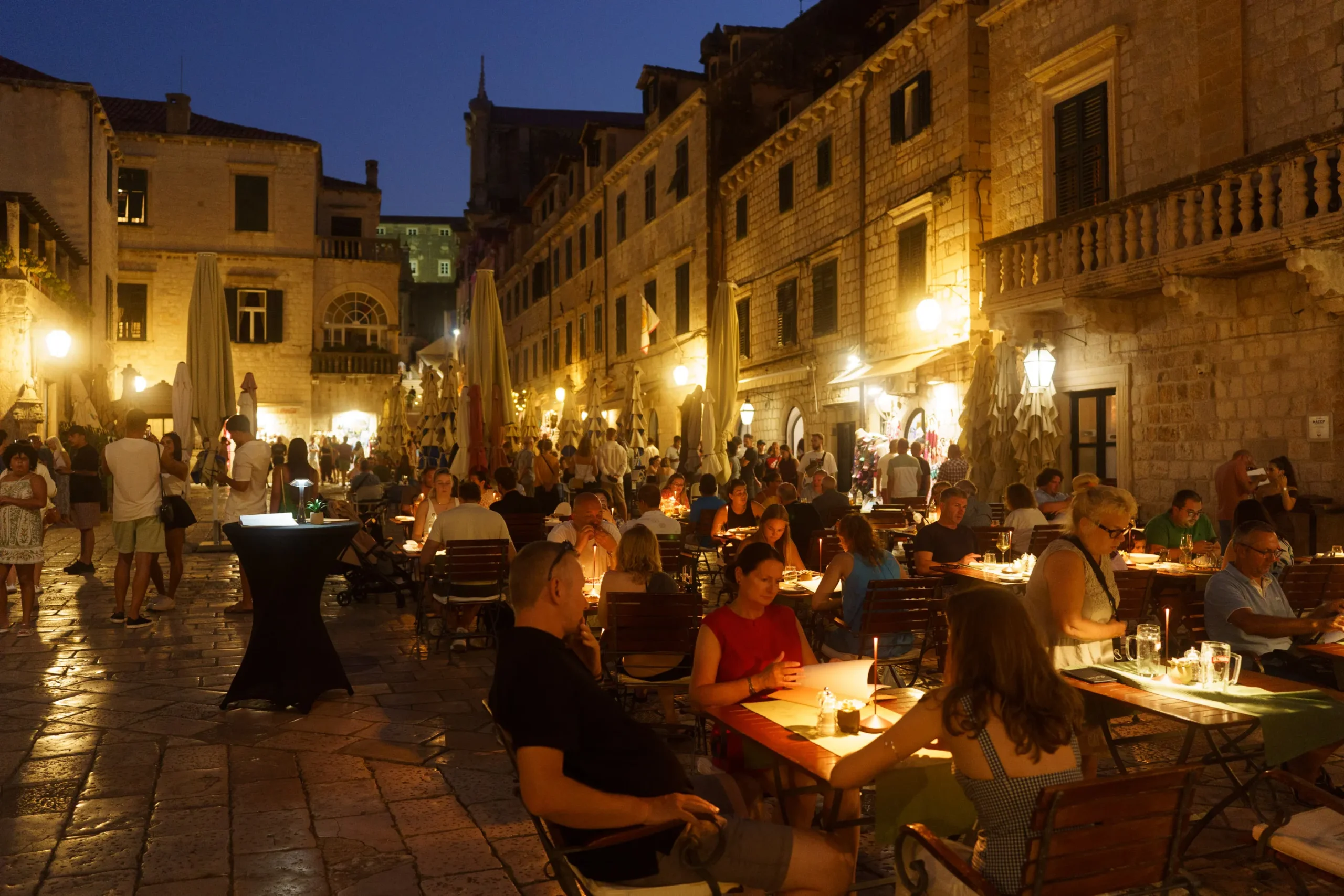 Guests sharing a meal on a small luxury cruise Croatia trip