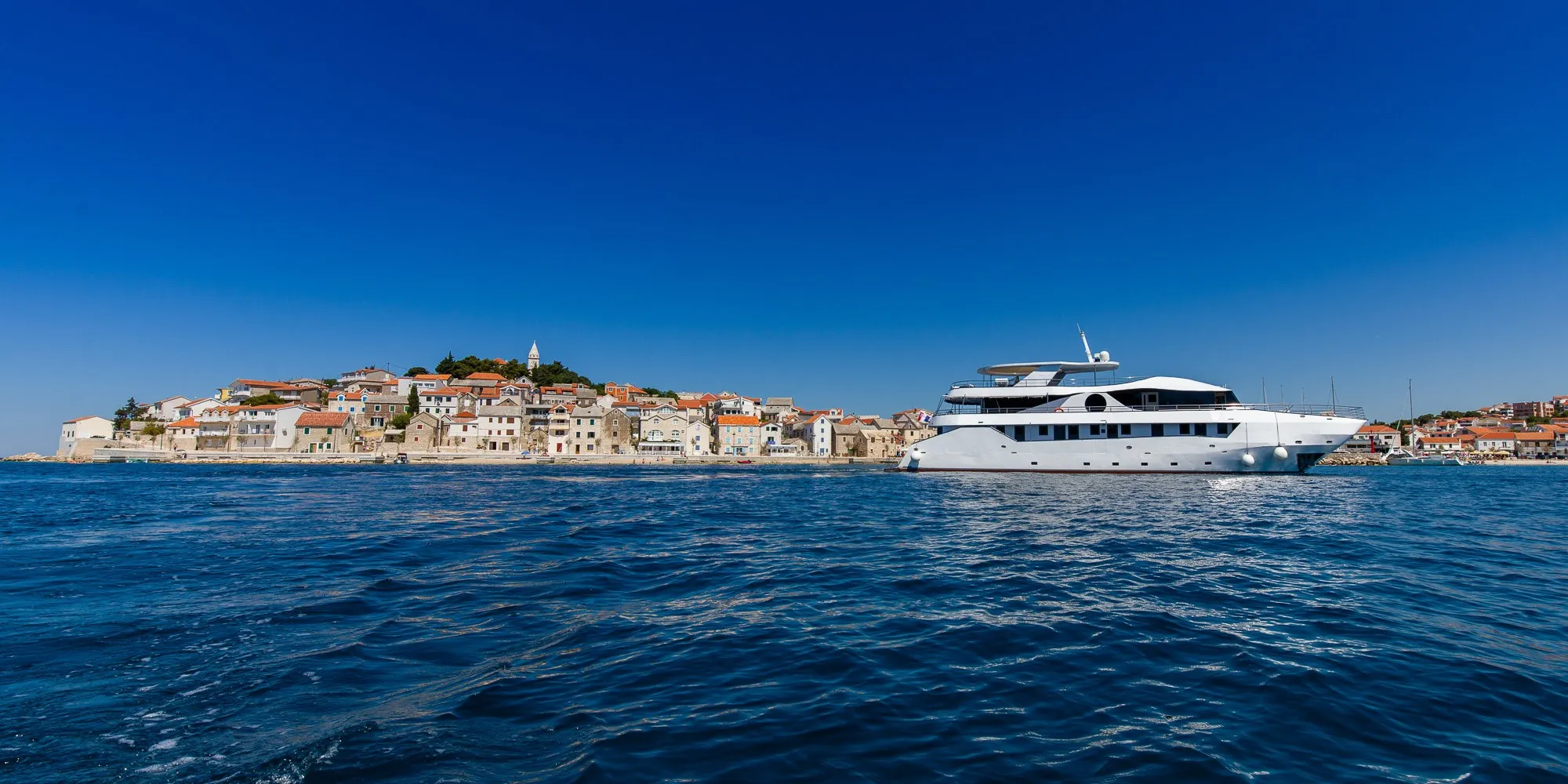 Small luxury cruise ship at anchor — Croatia 2027