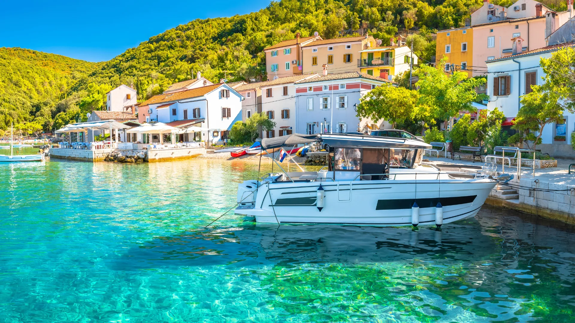 Turquoise cove and waterfront village on Cres island, Kvarner stop on our Croatia small ship cruise