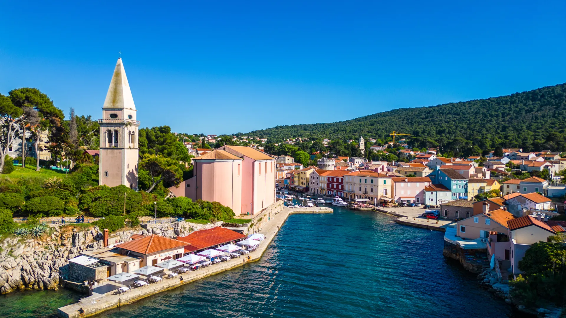 Mali Lošinj harbour and bell tower, small ship cruise stop on the Adriatic coast of Croatia